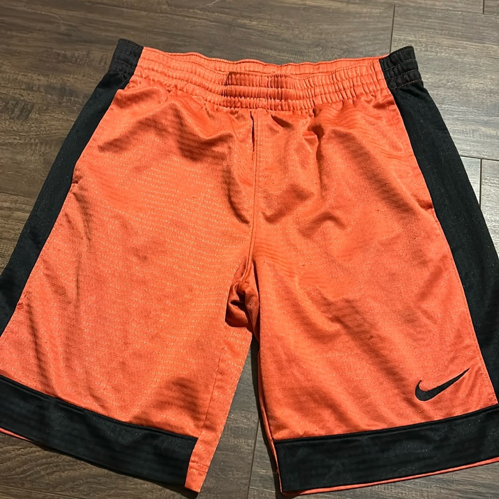 Orange and black basketball shorts